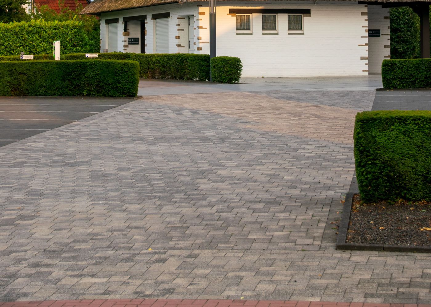 Block paved driveway laid in herringbone pattern